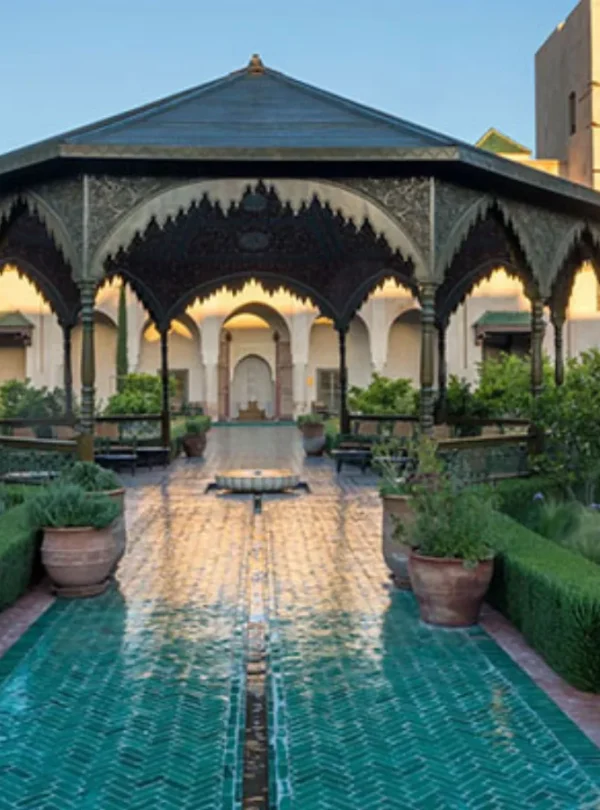 Exotic plants and traditional fountains inside Le Jardin Secret in Marrakech Medina