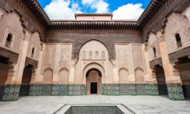 Stunning architecture of Medersa Ben Youssef courtyard during a guided tour in Marrakech
